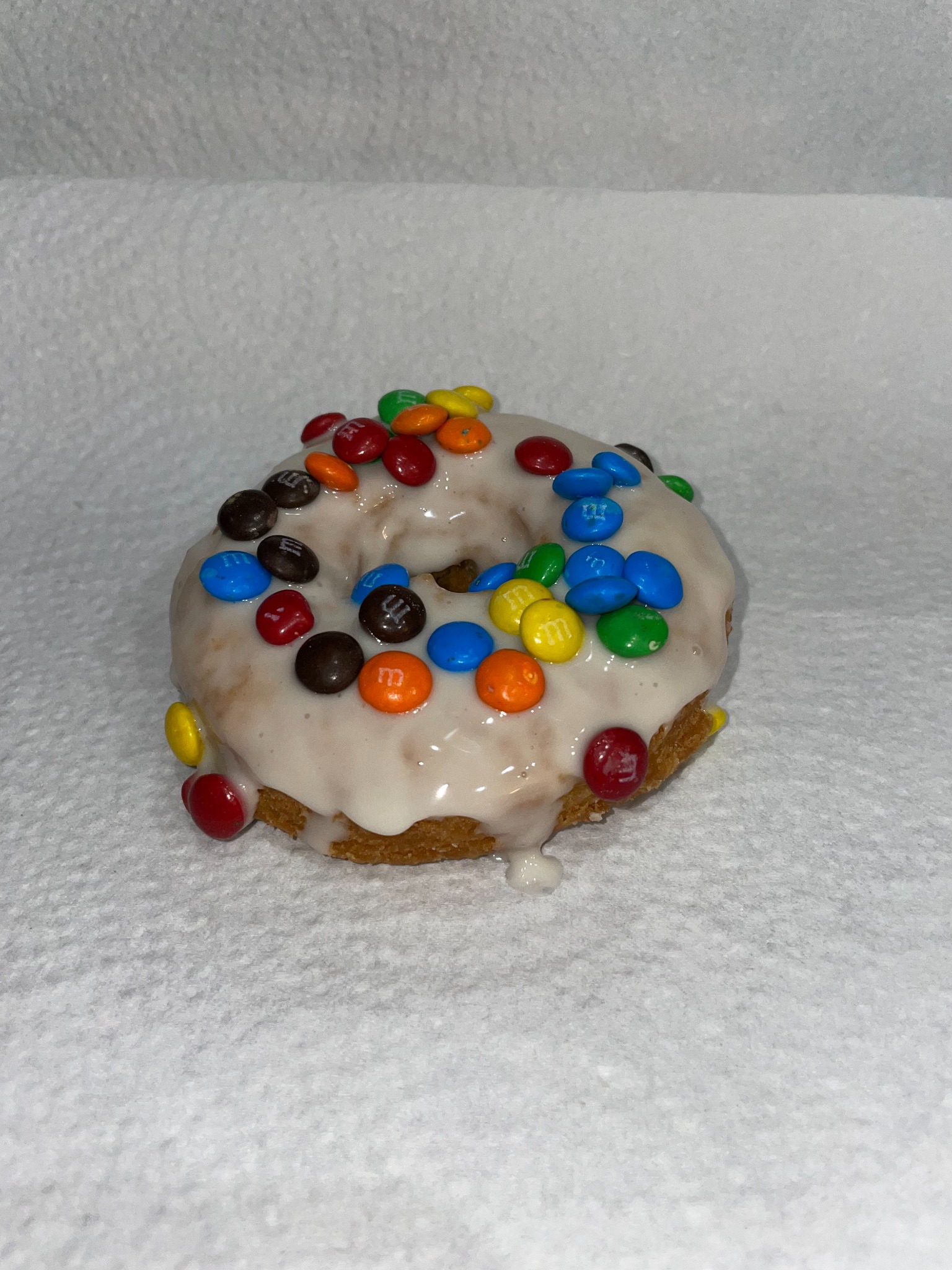 Our vanilla cake donut with vanilla icing and M&Ms
